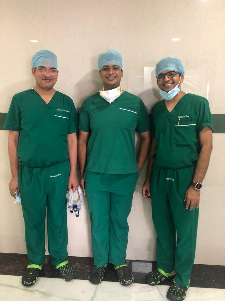 Dr. Sunil Kumar Yadav and surgical team performing hand surgery in Gurugram